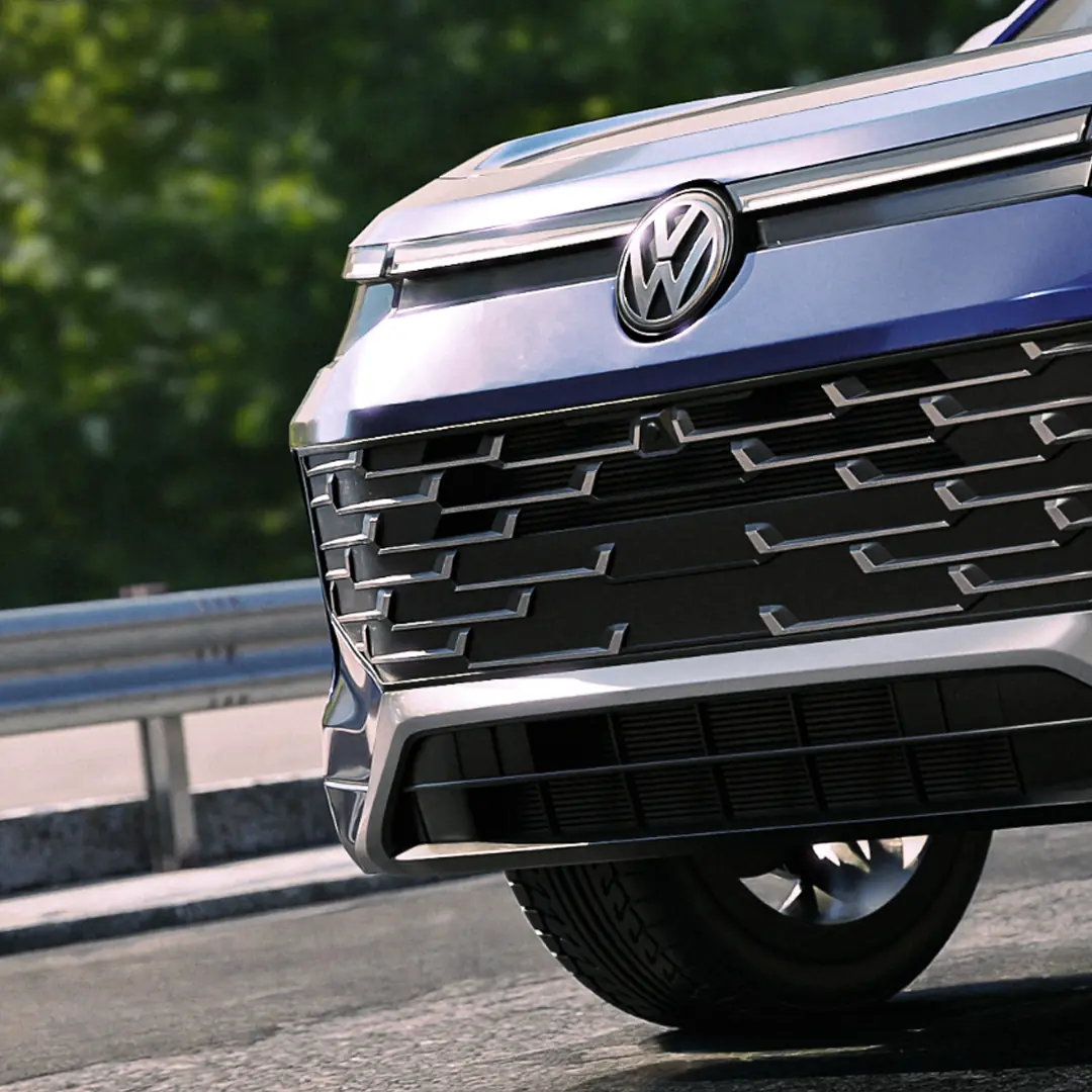 Close-up of the Tayron's front grille and VW logo